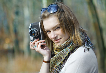 Woman with old camera