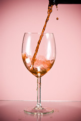 Red wine poured into glass