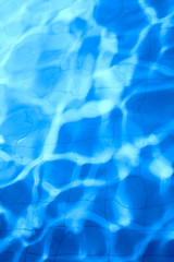 pattern of clean water in a blue swimming pool