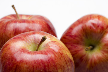 Three juicy apples lay ion white background