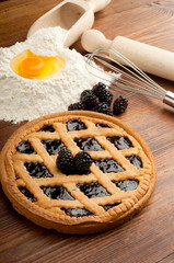 raspberry crostata with flour egg and rolling pin