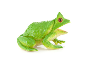 PLastic green frog toy over white background