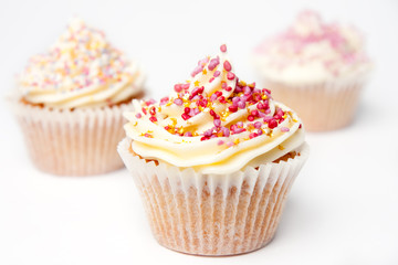 Three Homemade Cupcakes on White