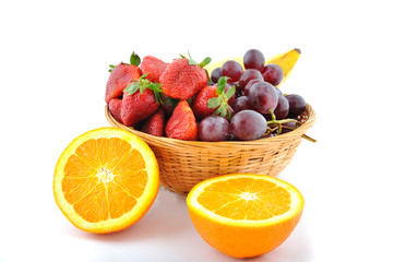 Basket of fruits with two orange around