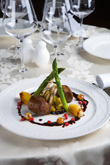 Meat under sauce with vegetables