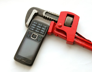 Telephone and adjustable spanner.