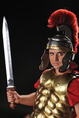 Handsome legionary soldier with a gladius