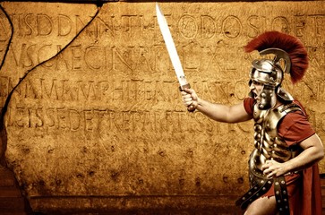 Roman legionary soldier in front of abstract wall - obrazy, fototapety, plakaty