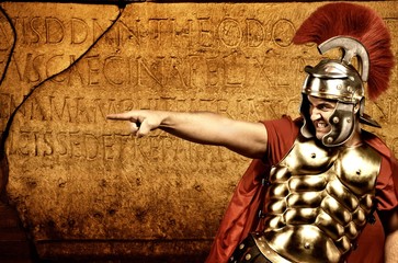 Roman legionary soldier in front of abstract wall