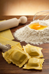 italian ravioli homemade with flour and rolling pin