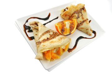 two pancakes on porcelan dish