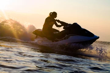 Acrylic prints Water Motor sports beautiful girl riding her jet skis