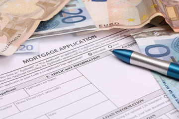 Home Loan Application Form and Pen