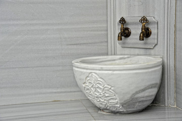 tabs and a marble basin in a turkish bath