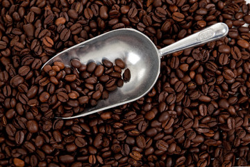Background of coffee beans with scoop
