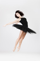 Stylish and young ballet style dancer is jumping