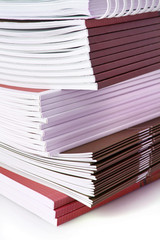 Pile of color magazines isolated on white background