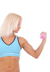 Woman holding pink dumbbells