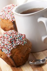 Tasty muffins with cup of tea