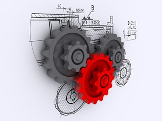 metallic gears against a background of engineering drawings