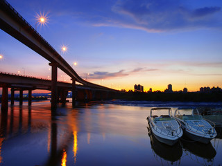 Sunset and bridge in riverside