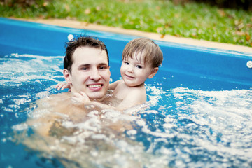 dad and son swimming