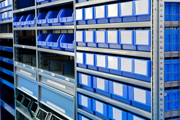 Blue boxes on a stock bin in warehouse