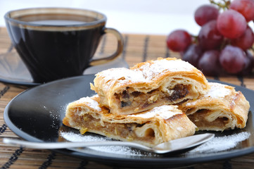 Apple pie with coffee and grapes
