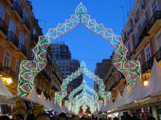 Calle de Valencia iluminada en fallas. - obrazy, fototapety, plakaty