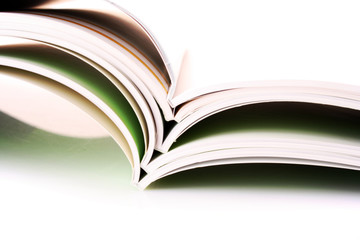 Pile of color magazines isolated on white background