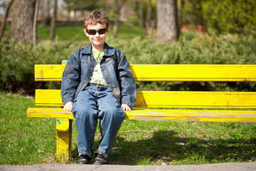 Cool kid sitting on bench