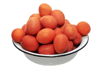 full bowl of red eggs on a white background
