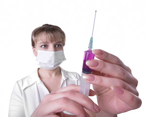female doctor with mask holding syringe