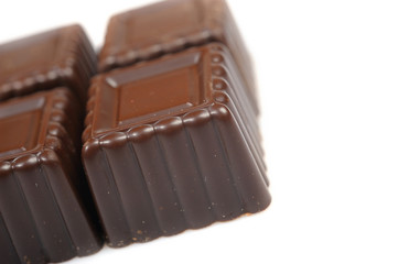 Delicious background of swiss dark chocolates, milk chocolates,