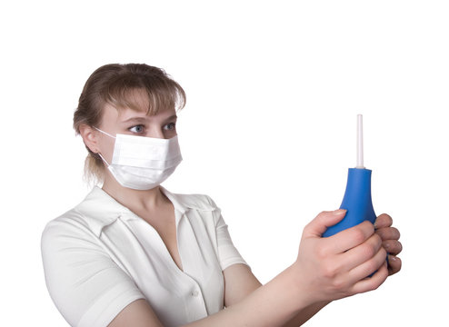 beautiful medical worker holding a blue enema