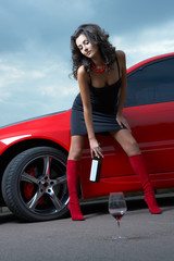 woman with  wine glass  in the car