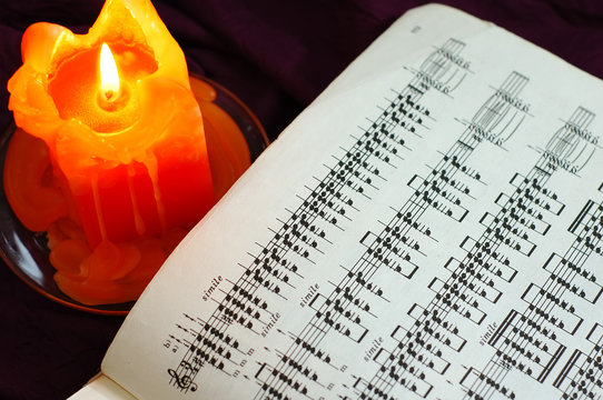 candle with sheet music