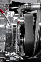 Zelfklevend Fotobehang drive belt and parts on a performance car engine © Steve Mann