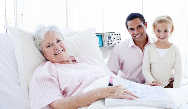 Lovely little girl with her father visiting her grandmother