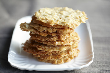 almond flaked cookies on a white plate