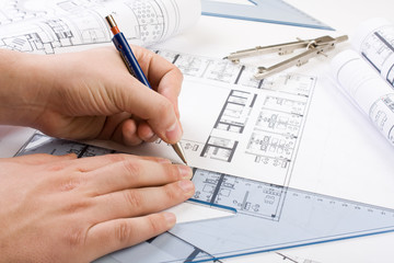 Architectural plans and blueprints in office