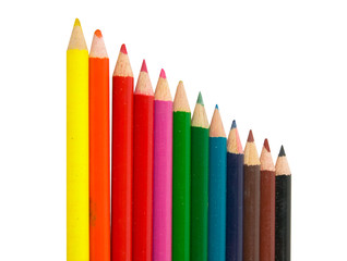 Colored wooden crayons pencils in row