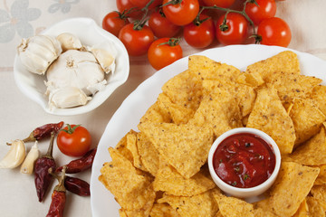 Tortilla chips with hot salsa dip