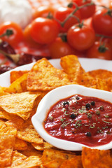 Tortilla chips with hot salsa dip