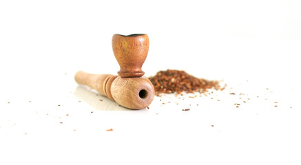 wooden pipe for smoking marijuana, dry milled leaves