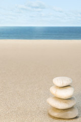 Fototapeta na wymiar Balanced stone on beach