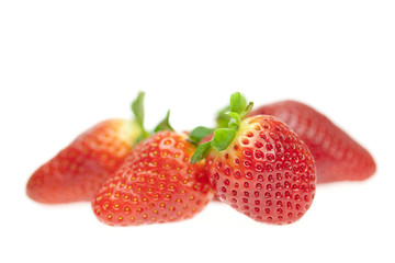 juicy strawberries isolated on white