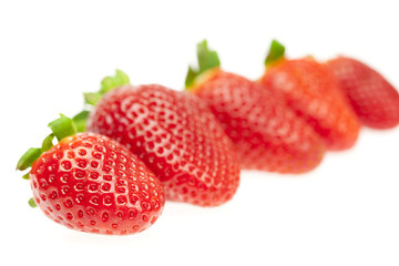 juicy strawberries isolated on white