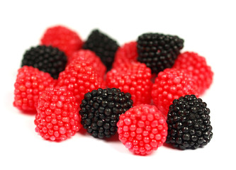 Sweet blackberries and raspberries on white background.