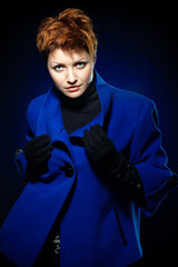 Lady in a blue topcoa